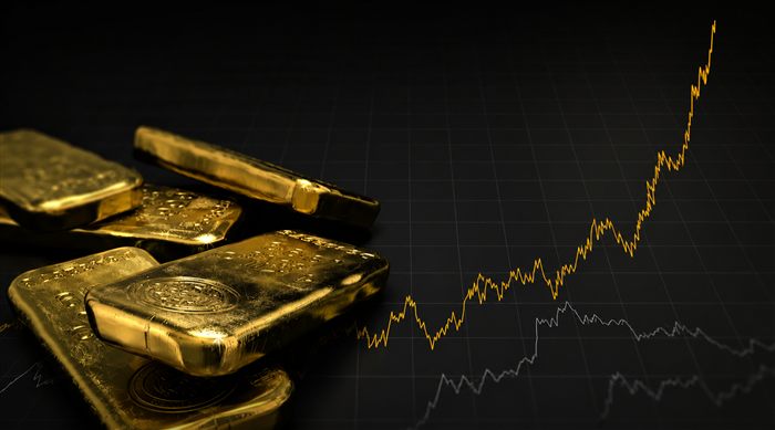 Lingots d'or et courbe boursière en forte hausse — l'or comme valeur refuge